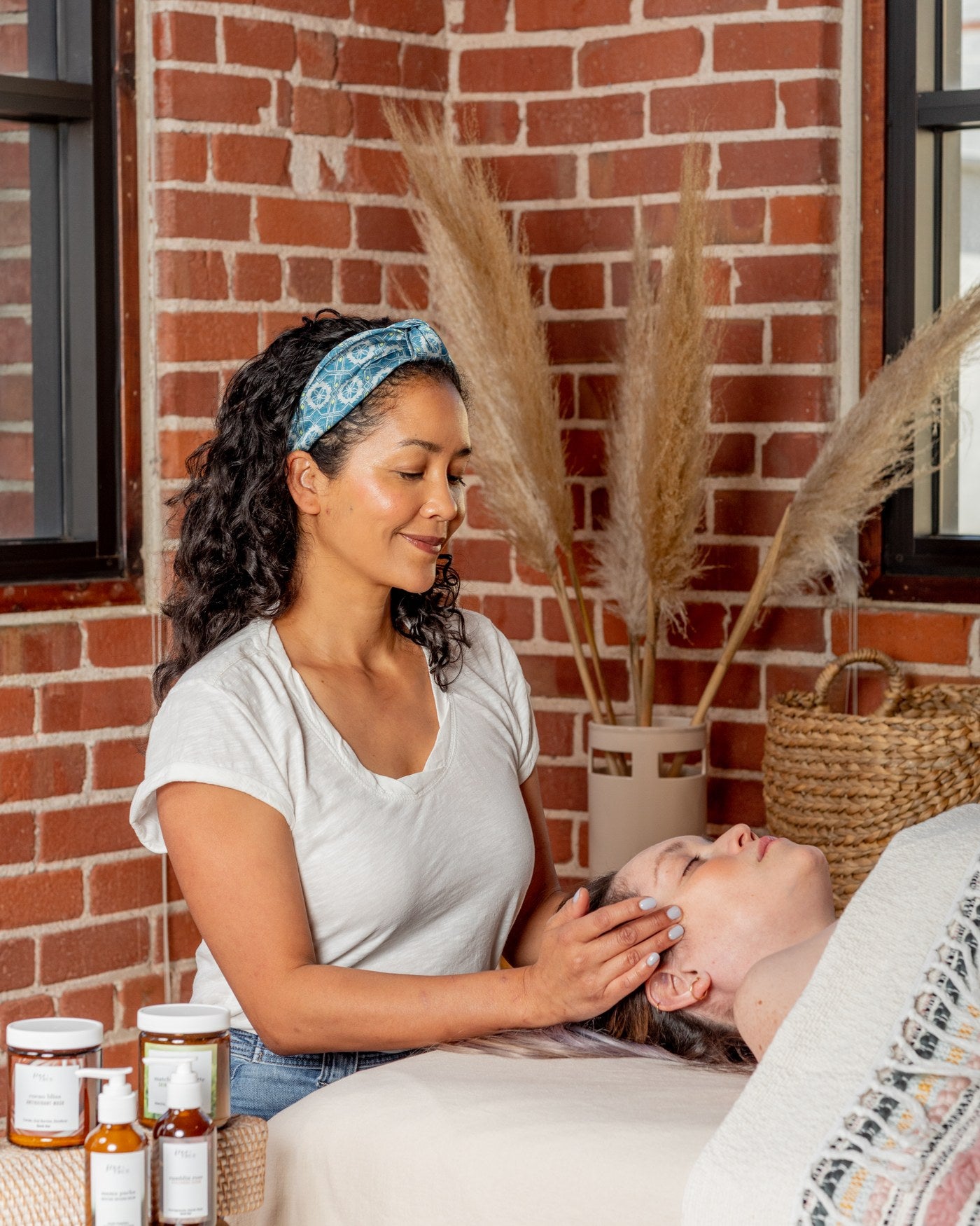Tami Blake giving a facial treatment