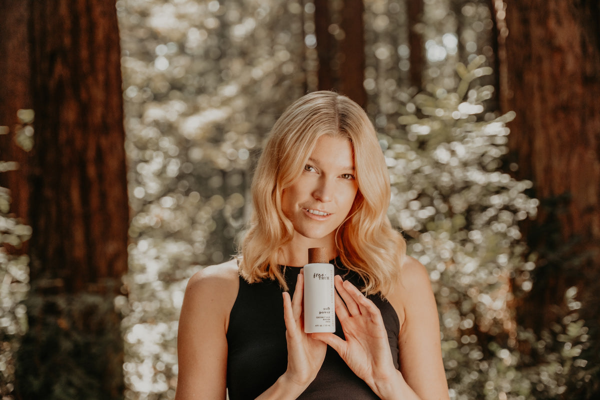Soft Power — smiling portrait holding the product
